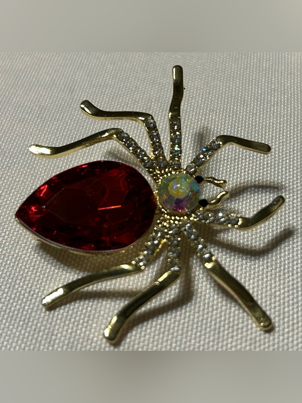Gold-Tone Spider Brooch with Red Teardrop and Iridescent Center